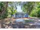 Charming home with blue siding, front porch, and landscaped yard at 4515 Isaac Ln, Sanford, FL 32771
