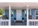 Inviting front porch with seating and a view of the landscaped yard at 4515 Isaac Ln, Sanford, FL 32771