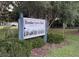 Bookertown Park sign with a decorative design nestled among green foliage in a natural setting at 4515 Isaac Ln, Sanford, FL 32771