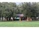 Picturesque park pavilion surrounded by mature trees and green grass offering a perfect spot for outdoor gatherings at 4515 Isaac Ln, Sanford, FL 32771