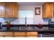Kitchen sink with modern faucet, granite countertops, and light-colored cabinetry at 4515 Isaac Ln, Sanford, FL 32771