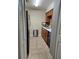 Efficient kitchen featuring tile floors and countertops, and dark appliances at 4936 Tangerine Ave # 4936, Winter Park, FL 32792