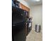Efficient kitchen featuring tile floors and countertops, and dark appliances at 4936 Tangerine Ave # 4936, Winter Park, FL 32792