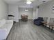 Spacious living room with hardwood floors and ample seating and dining area at 4936 Tangerine Ave # 4936, Winter Park, FL 32792