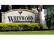 Wrenwood Condominiums community sign with lush landscaping at 4936 Tangerine Ave # 4936, Winter Park, FL 32792
