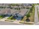 Aerial view of a single-story home with a two-car garage in a suburban neighborhood at 567 Pinecrest Loop, Davenport, FL 33837