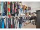 Spacious walk-in closet with ample shelving and storage space, featuring a built-in vanity area at 567 Pinecrest Loop, Davenport, FL 33837