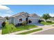 Charming single-story home with a well-manicured lawn, attached garage, and appealing architectural details at 567 Pinecrest Loop, Davenport, FL 33837