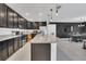 Spacious kitchen with stainless steel appliances, granite countertops, and a large island, great for cooking at 567 Pinecrest Loop, Davenport, FL 33837