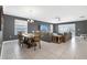 Comfortable living room with an open layout with dining table and tile floors at 567 Pinecrest Loop, Davenport, FL 33837