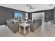 Cozy living room with tile floors, recessed lighting, and sliding doors at 567 Pinecrest Loop, Davenport, FL 33837