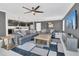 Spacious living room featuring an open concept design with neutral walls and modern furnishings at 567 Pinecrest Loop, Davenport, FL 33837