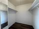 Walk-in closet with ample shelving space and hardwood floors for organized storage at 592 Orange Dr # 142, Altamonte Springs, FL 32701