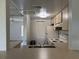 Open kitchen view with standard appliances and a breakfast bar leading into the living room at 592 Orange Dr # 142, Altamonte Springs, FL 32701