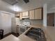 Kitchen with essential appliances, double sinks, and white cabinets, creating a practical cooking space at 592 Orange Dr # 142, Altamonte Springs, FL 32701