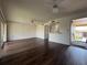 Spacious living room with hardwood floors, ceiling fans, and a breakfast bar leading into the kitchen at 592 Orange Dr # 142, Altamonte Springs, FL 32701