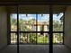 Screened patio showing beautiful landscaping, building, and sky at 592 Orange Dr # 142, Altamonte Springs, FL 32701