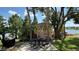 Picnic area with gazebo and lake view, surrounded by lush trees at 592 Orange Dr # 142, Altamonte Springs, FL 32701