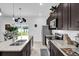 Spacious kitchen featuring granite countertops, a stainless steel refrigerator, and plenty of counter space at 606 Marion Oaks Blvd, Ocala, FL 34473