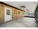 This screened back porch features two ceiling fans and a nice view of the backyard at 606 Ohio Ave, St Cloud, FL 34769