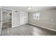 The bedroom has light gray walls, tile flooring, a window, and closet space at 606 Ohio Ave, St Cloud, FL 34769