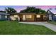 Charming single-story home with a covered porch and well-maintained lawn at 606 Ohio Ave, St Cloud, FL 34769