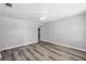 Spacious living room with modern flooring, a ceiling fan, and neutral paint at 606 Ohio Ave, St Cloud, FL 34769