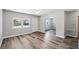 Inviting living room with light gray walls, modern flooring and archway detail at 606 Ohio Ave, St Cloud, FL 34769