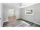 Inviting living room featuring arched doorways, fresh paint, and modern flooring at 606 Ohio Ave, St Cloud, FL 34769