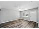 Bright living room with stylish flooring, a ceiling fan, and fresh paint at 606 Ohio Ave, St Cloud, FL 34769