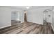 Bright living room with modern floors, arched doorways, and fresh neutral paint at 606 Ohio Ave, St Cloud, FL 34769