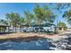 Scenic park view with picnic areas, playground under a sun shade, and a walking trail at 606 Ohio Ave, St Cloud, FL 34769