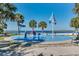 Fun splash pad with colorful water features and palm trees, perfect for to play at 606 Ohio Ave, St Cloud, FL 34769