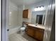 Clean bathroom featuring a vanity, toilet, and a shower-tub at 6169 Metrowest Blvd # 102, Orlando, FL 32835