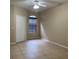 Neutral bedroom with tile flooring, a large window, and a closet at 6169 Metrowest Blvd # 102, Orlando, FL 32835