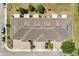 An aerial view shows the well maintained roof, landscaping, and brick paver driveways of this lovely townhouse at 617 Joyful Blossom Pl, Longwood, FL 32750