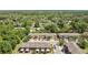 This aerial view showcases this community surrounded by lush landscapes and trees at 617 Joyful Blossom Pl, Longwood, FL 32750