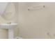 Powder room with a pedestal sink and chrome faucet at 617 Joyful Blossom Pl, Longwood, FL 32750