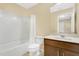 Bathroom with a white vanity, marble countertops and shower with white tile at 617 Joyful Blossom Pl, Longwood, FL 32750