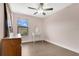 Bedroom featuring a window, ceiling fan, vanity table, dresser and hard wood floors at 617 Joyful Blossom Pl, Longwood, FL 32750