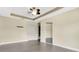 Bedroom featuring a ceiling fan, gray wood-look floors, closet and white doors at 617 Joyful Blossom Pl, Longwood, FL 32750