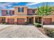 Charming townhome featuring a brick driveway, a one car garage, and inviting curb appeal with landscaping at 617 Joyful Blossom Pl, Longwood, FL 32750