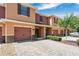 Charming townhome featuring a brick driveway, a one car garage, and inviting curb appeal with landscaping at 617 Joyful Blossom Pl, Longwood, FL 32750