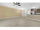 Spacious living room with tile floors, ceiling fan and open floor plan to the kitchen at 617 Joyful Blossom Pl, Longwood, FL 32750
