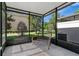 Screened patio with a wicker bench at 617 Joyful Blossom Pl, Longwood, FL 32750