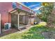 Relax in this home's screened-in patio while enjoying your large backyard, perfect for outdoor living and entertaining at 617 Joyful Blossom Pl, Longwood, FL 32750