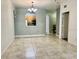 Bright dining area featuring tile floors and a view into the adjacent kitchen at 6451 Old Park Ln # 102, Orlando, FL 32835