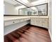 Vanity area in the bathroom featuring a big countertop, drawers, and mirrors at 721 Rock Creek Loop, Longwood, FL 32750