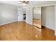 Bedroom with laminate flooring, mirrored closet doors, and ceiling fan at 721 Rock Creek Loop, Longwood, FL 32750