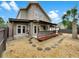 Exterior home view with a covered patio and rock landscaping at 721 Rock Creek Loop, Longwood, FL 32750